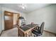 Bedroom or office with large desk, carpet, ceiling fan, and natural light at 18263 E Berry Dr, Centennial, CO 80015