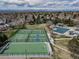 Aerial view of community amenities, including tennis courts, hockey rink, and a pool at 18263 E Berry Dr, Centennial, CO 80015
