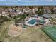Aerial view of the community area with a pool, playground, and recreational facilities at 18263 E Berry Dr, Centennial, CO 80015
