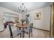 Cozy dining room with seating for four and chandelier lighting fixture at 18263 E Berry Dr, Centennial, CO 80015