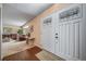 Welcoming entryway showcasing double doors and a glimpse of the carpeted living room at 18263 E Berry Dr, Centennial, CO 80015