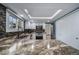 Bright kitchen with white cabinets, granite countertops and stainless steel appliances at 18263 E Berry Dr, Centennial, CO 80015