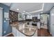 Updated kitchen features granite counters, mosaic backsplash, and stainless steel appliances at 18263 E Berry Dr, Centennial, CO 80015