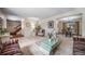 Open-concept space with living and dining areas, showcasing neutral walls and carpet at 18263 E Berry Dr, Centennial, CO 80015