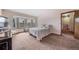 Spacious primary bedroom features a large bay window and plush carpeting at 18263 E Berry Dr, Centennial, CO 80015