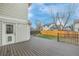 Backyard featuring an wood deck, small lawn and rod iron fencing at 116 S Lindsey St, Castle Rock, CO 80104