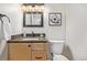 Bathroom featuring a single vanity sink, granite countertop, and toilet at 116 S Lindsey St, Castle Rock, CO 80104