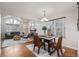 Open-concept dining room next to the living room with hardwood floors and lots of light at 116 S Lindsey St, Castle Rock, CO 80104