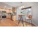 Open kitchen with an island breakfast bar, stainless appliances, and wooden cabinets at 116 S Lindsey St, Castle Rock, CO 80104