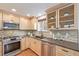 Charming kitchen with stainless steel appliances, granite countertops, and tile backsplash at 116 S Lindsey St, Castle Rock, CO 80104
