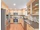 Well-equipped kitchen features stainless steel appliances, stone countertops, and wood cabinets at 116 S Lindsey St, Castle Rock, CO 80104