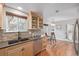 Eat-in kitchen with breakfast table, stainless steel appliances, and hardwood flooring at 116 S Lindsey St, Castle Rock, CO 80104