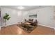 Inviting living room with a comfortable sofa, decorative rug, wood floors, and natural light, perfect for relaxation at 116 S Lindsey St, Castle Rock, CO 80104