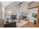 Inviting living room boasts a fireplace, high ceilings, and lots of natural light at 116 S Lindsey St, Castle Rock, CO 80104