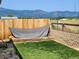Fenced backyard with artificial turf, hammock and view of the mountains at 785 Century Ln, Monument, CO 80132