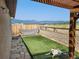 This backyard offers nice views and a pet-friendly turf area, plus a lounging dog at 785 Century Ln, Monument, CO 80132