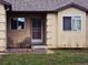 Inviting front porch with decorative metal security door and outdoor seating area at 785 Century Ln, Monument, CO 80132