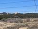 A scenic view of a rugged mountain landscape from behind a barbed wire fence at 785 Century Ln, Monument, CO 80132
