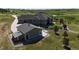 Aerial view of the estate, showcasing a lush yard, detached garage, and serene, picturesque surroundings at 960 Promontory Cir, Elizabeth, CO 80107