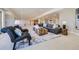 Spacious basement features a sitting area, sofa, and a carpeted floor at 960 Promontory Cir, Elizabeth, CO 80107