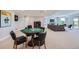Wide view of the basement game and sitting areas with natural light at 960 Promontory Cir, Elizabeth, CO 80107