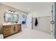 This bathroom features a single vanity, modern mirror, and a walk in shower at 960 Promontory Cir, Elizabeth, CO 80107