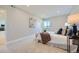 Spacious bedroom with plush carpet, a large window and a view of the golf course at 960 Promontory Cir, Elizabeth, CO 80107