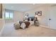 Spacious bedroom with plush carpet, a sitting area, and two side tables with lamps at 960 Promontory Cir, Elizabeth, CO 80107