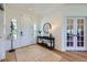 Bright foyer with light wood floors, a decorative rug, and stylish console table at 960 Promontory Cir, Elizabeth, CO 80107
