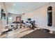 Basement gym features a punching bag, weight machine, and plenty of room for activities at 960 Promontory Cir, Elizabeth, CO 80107