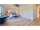 Spacious main bedroom with large windows, hardwood floors, and neutral color scheme at 960 Promontory Cir, Elizabeth, CO 80107