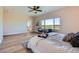 Bright main bedroom with an ensuite bathroom, large windows, and stylish decor at 960 Promontory Cir, Elizabeth, CO 80107