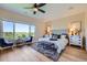 Comfortable main bedroom with scenic views, hardwood floors, and stylish decor at 960 Promontory Cir, Elizabeth, CO 80107