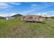 A charming home with a wooden deck and lush lawn, perfect for outdoor relaxation and enjoying nature at 11173 Emerald Ln, Conifer, CO 80433