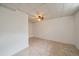 Finished basement with tiled floor and a brightly colored ceiling fan at 11173 Emerald Ln, Conifer, CO 80433