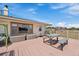 A relaxing outdoor deck with seating, a picnic table, and lovely views of the natural surroundings at 11173 Emerald Ln, Conifer, CO 80433