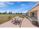 Inviting outdoor deck area featuring a picnic table and bench seating, perfect for relaxation and entertaining at 11173 Emerald Ln, Conifer, CO 80433