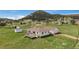 Charming single-Gathering home featuring a deck and lush greenery with views of the surrounding mountainous landscape at 11173 Emerald Ln, Conifer, CO 80433