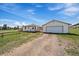 Exterior view of the home, garage and fenced yard at 11173 Emerald Ln, Conifer, CO 80433