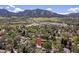 Aerial view of the property amidst lush greenery, showcasing its location with mountain views at 270 31St St, Boulder, CO 80305