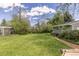 Expansive backyard featuring a well-maintained lawn, mature trees, and a storage shed at 270 31St St, Boulder, CO 80305