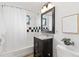 Updated bathroom with vanity, granite countertop, and black and white tiled shower at 270 31St St, Boulder, CO 80305