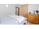 Bedroom features a dresser, wooden closet, and light-filled window with a lovely view at 270 31St St, Boulder, CO 80305