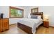 Bedroom with hardwood floors, a large bed, and natural light from two windows at 270 31St St, Boulder, CO 80305