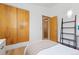 Bedroom featuring hardwood floors, closet, and a ladder shelving unit on the wall at 270 31St St, Boulder, CO 80305