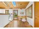 Bright dining area with wood ceilings, a round table, and a view to the backyard at 270 31St St, Boulder, CO 80305