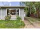 Charming single-story home with blooming flowerbeds, a stone pathway, and a detached garage at 270 31St St, Boulder, CO 80305