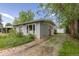 Inviting single-story home with a stone pathway, vibrant flowerbeds, and a detached garage at 270 31St St, Boulder, CO 80305