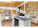Modern kitchen with a stovetop, breakfast bar, wood ceilings, and ample natural light at 270 31St St, Boulder, CO 80305