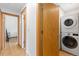 Hallway view of the laundry area featuring a stacked washer and dryer unit at 270 31St St, Boulder, CO 80305
